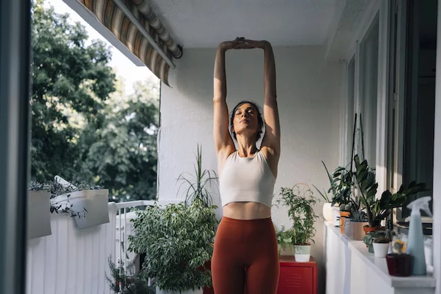 Healthy woman stretching outside