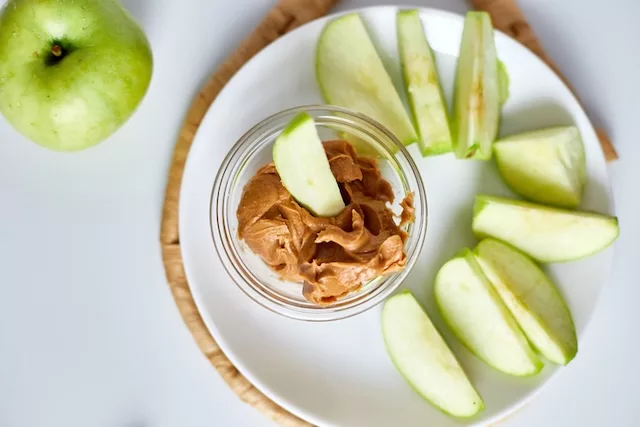 high-fiber snacks. Apple with peanut butter.